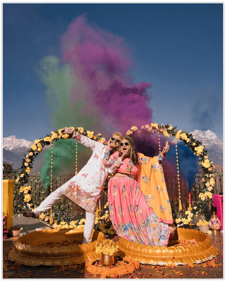 Destination wedding stage decoration with colour smoke couple shoot