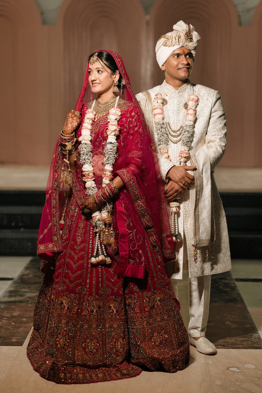 Bride and groom in traditional wedding outfits planned by Wedding Planner Dehradun